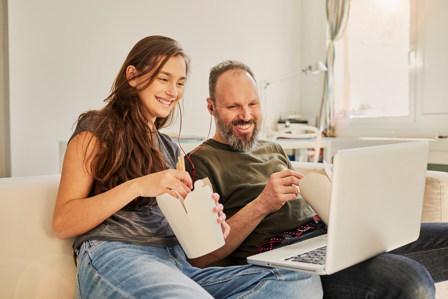 Father and daughter watching a movie together